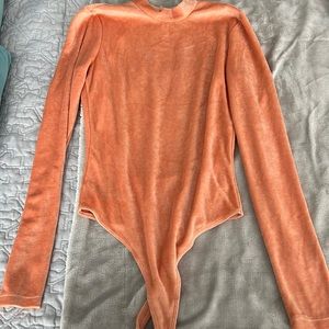 Vintage coral velvety bodysuit with snap neck enclosure